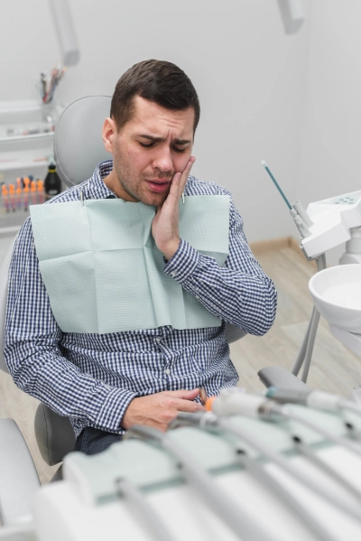 Dentist reviewing a 3-D scan of impacted wisdom teeth before removal