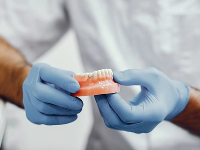 Van Buren patient smiling after receiving fixed All-on-4 teeth