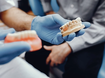 Van Buren patient smiling after receiving fixed All-on-4 teeth