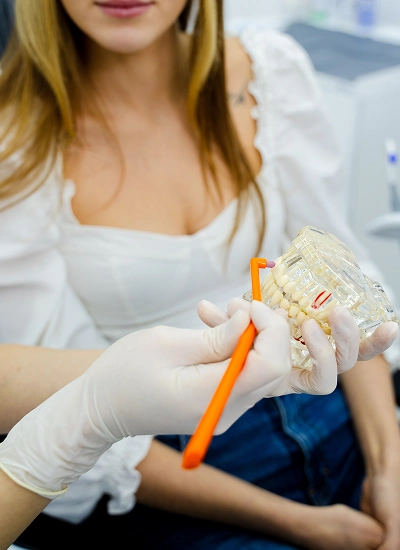 Dentist reviewing a 3-D scan to plan bone grafting before implants