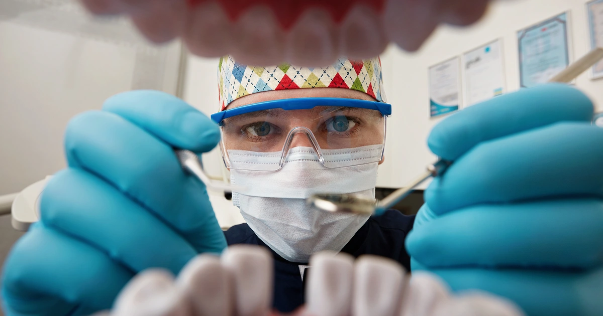 Dentist checking patient's lost filling